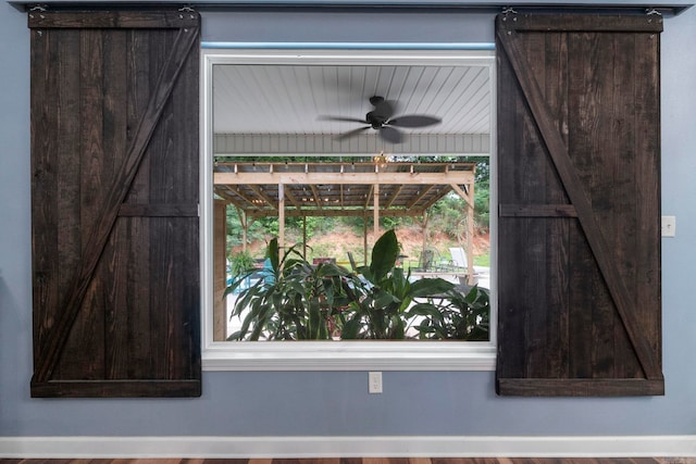 10820 W Sardis Rd, Bauxite, AR 72011 - detailed view of a barn door and a ceiling fan