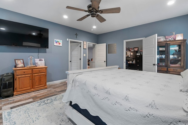 10820 W Sardis Rd, Bauxite, AR 72011 - bedroom featuring wood finished floors, baseboards, recessed lighting, and a ceiling fan