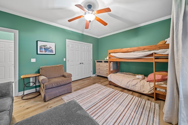 640 Ariridge Rd Unit D6, Hot Springs, AR 71913 - bedroom with ornamental molding, wood finished floors, a closet, baseboards, and ceiling fan