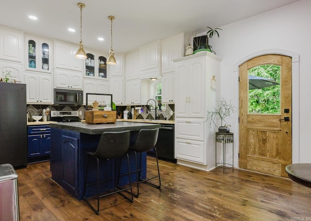 1112 Lawrence Ln, Benton, AR 72019 - kitchen featuring black appliances, white cabinetry, dark wood-type flooring, blue cabinets, and a kitchen island