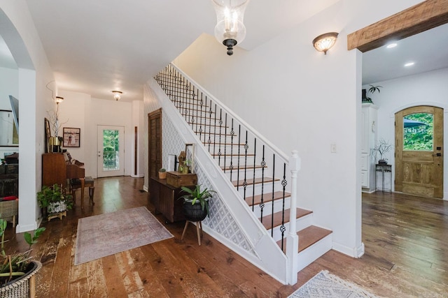1112 Lawrence Ln, Benton, AR 72019 - stairway featuring hardwood / wood-style flooring, arched walkways, and baseboards