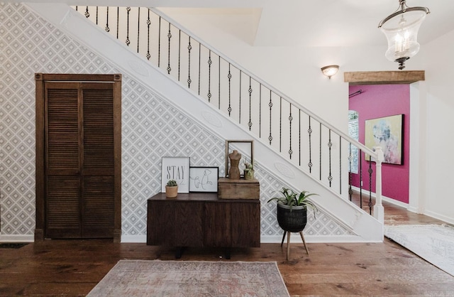 1112 Lawrence Ln, Benton, AR 72019 - staircase with wood finished floors, baseboards, and wallpapered walls