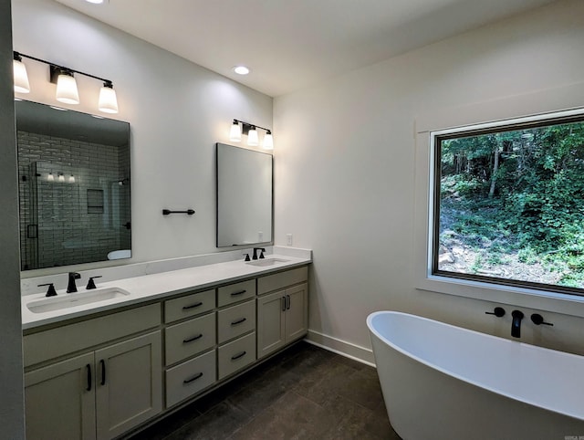 80 Stone Cir, Greers Ferry, AR 72067 - bathroom with double vanity, a shower stall, a soaking tub, recessed lighting, and baseboards