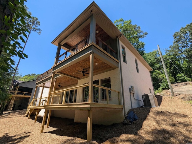 80 Stone Cir, Greers Ferry, AR 72067 - back of property featuring a ceiling fan, a balcony, central AC unit, and a wooden deck
