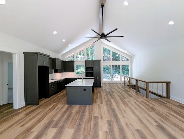 80 Stone Cir, Greers Ferry, AR 72067 - kitchen with a sink, light countertops, ceiling fan, light wood finished floors, and a center island with sink