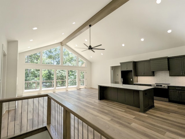 80 Stone Cir, Greers Ferry, AR 72067 - kitchen featuring stainless steel range with electric cooktop, light wood finished floors, a ceiling fan, open floor plan, and beam ceiling
