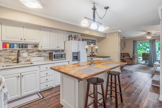100 Discovery Bay Ln Unit 6, Hot Springs, AR 71913 - kitchen featuring a sink, stainless steel microwave, white fridge with ice dispenser, butcher block counters, and open floor plan