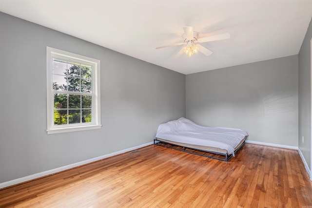 64 Castleberry Rd, Greenbrier, AR 72058 - bedroom featuring wood finished floors, baseboards, and a ceiling fan