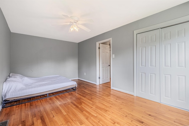 64 Castleberry Rd, Greenbrier, AR 72058 - bedroom with baseboards, light wood-style floors, a closet, and ceiling fan