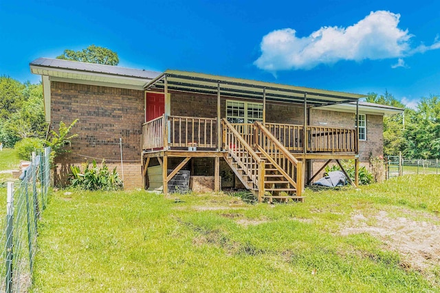 64 Castleberry Rd, Greenbrier, AR 72058 - rear view of property with a deck, brick siding, stairway, and metal roof
