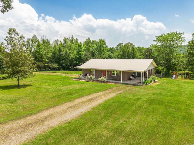 64 Castleberry Rd, Greenbrier, AR 72058 - view of front of property featuring driveway, a front lawn, covered porch, a carport, and a playground