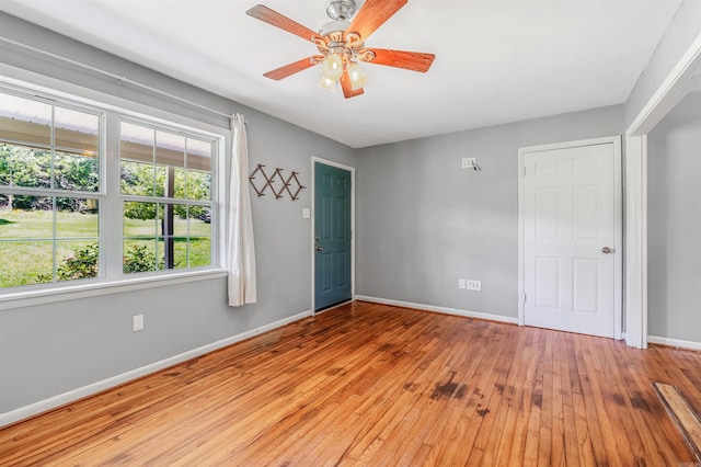 64 Castleberry Rd, Greenbrier, AR 72058 - spare room featuring baseboards, hardwood / wood-style flooring, and a ceiling fan