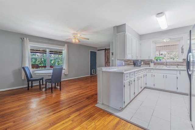 64 Castleberry Rd, Greenbrier, AR 72058 - kitchen with a sink, light countertops, white cabinets, tasteful backsplash, and ceiling fan