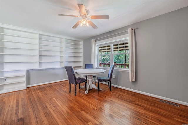 64 Castleberry Rd, Greenbrier, AR 72058 - dining room with hardwood / wood-style flooring, a ceiling fan, baseboards, and built in features