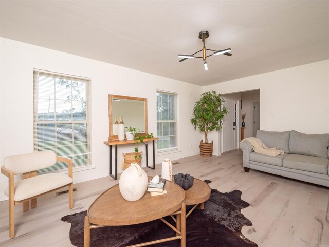 15 Brandywine Ln, Little Rock, AR 72227 - living area with wood finished floors and healthy amount of natural light