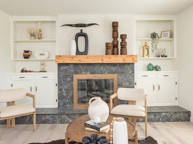15 Brandywine Ln, Little Rock, AR 72227 - living area with wood finished floors, a tile fireplace, and built in features