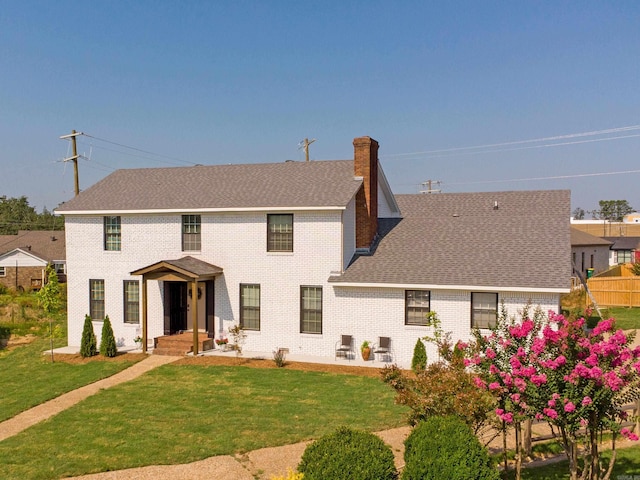 15 Brandywine Ln, Little Rock, AR 72227 - rear view of house with a chimney, brick siding, and a shingled roof