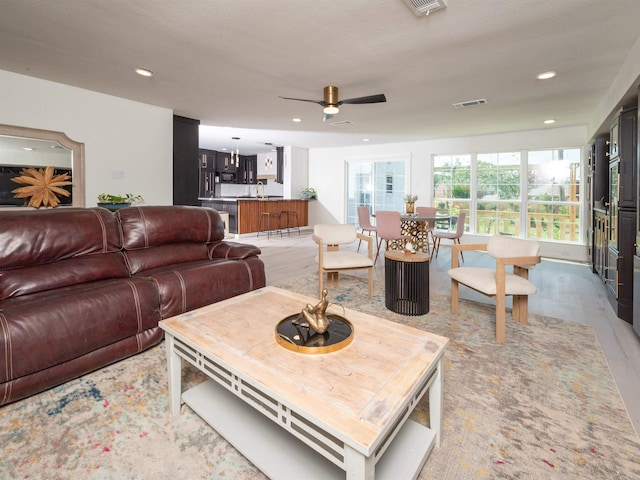 15 Brandywine Ln, Little Rock, AR 72227 - living room with a ceiling fan, light wood-type flooring, and recessed lighting