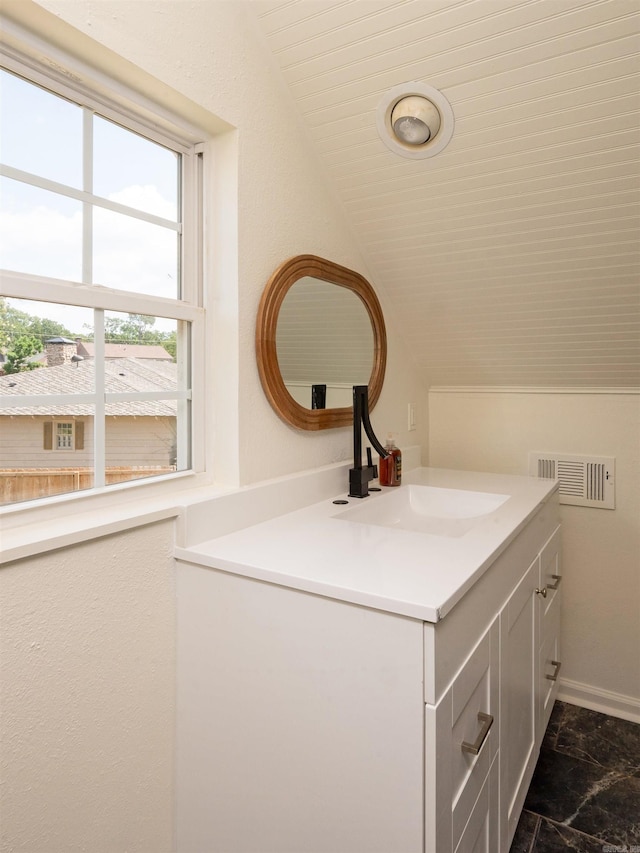 15 Brandywine Ln, Little Rock, AR 72227 - bathroom featuring vanity and lofted ceiling