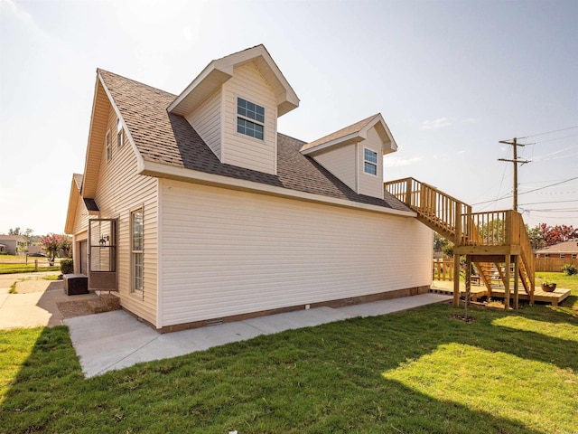 15 Brandywine Ln, Little Rock, AR 72227 - view of home's exterior with stairs, a lawn, and roof with shingles