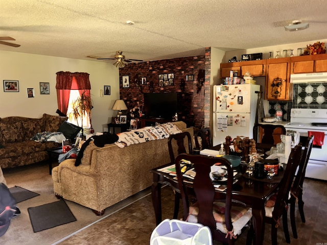 dining room with ceiling fan and a textured ceiling