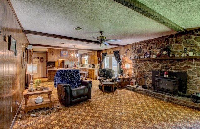 826 Carson Bridge Rd, Lonoke, AR 72086 - living area featuring wood walls, ceiling fan, a textured ceiling, beamed ceiling, and a wall mounted AC