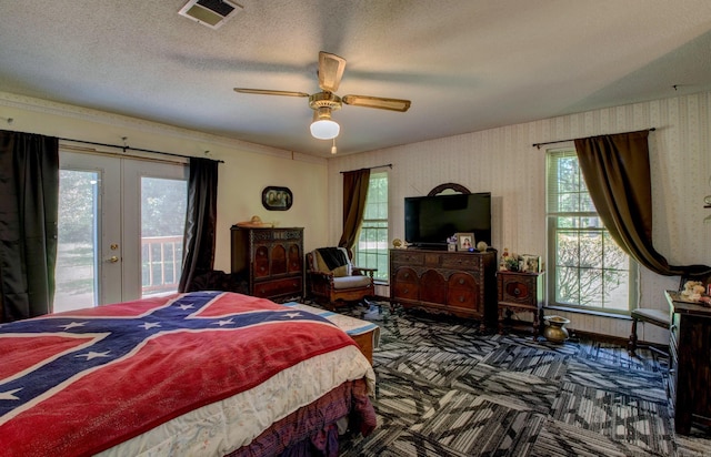 826 Carson Bridge Rd, Lonoke, AR 72086 - carpeted bedroom featuring access to outside, french doors, multiple windows, a ceiling fan, and wallpapered walls
