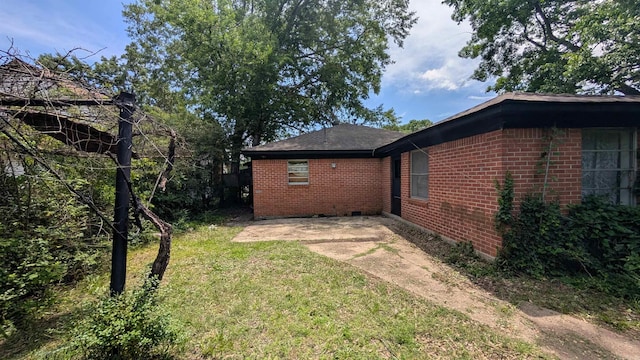 401 W S St, Benton, AR 72015 - view of side of home featuring brick siding and a lawn