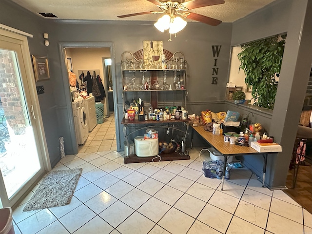 6625 Chateau Dr, Little Rock, AR 72209 - bar with washer and clothes dryer, ceiling fan, tile patterned floors, and a textured ceiling