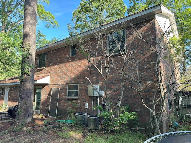 6625 Chateau Dr, Little Rock, AR 72209 - rear view of house featuring brick siding and cooling unit