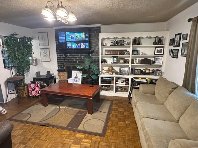 6625 Chateau Dr, Little Rock, AR 72209 - living room featuring a textured ceiling and a chandelier