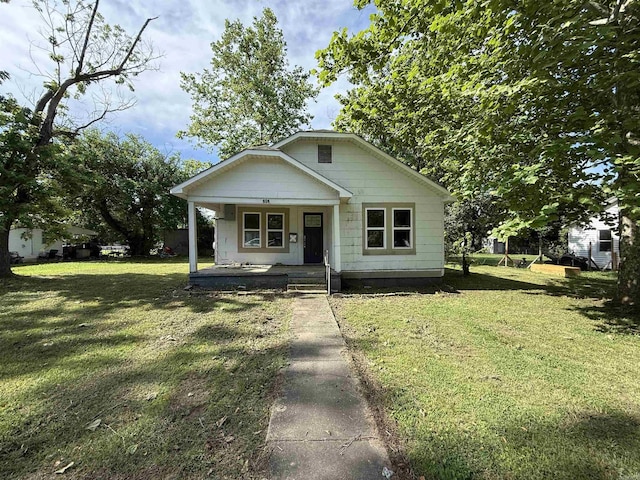 414 E 1st St, Rector, AR 72461 - bungalow with covered porch and a front yard