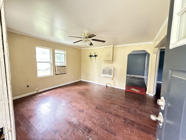 414 E 1st St, Rector, AR 72461 - unfurnished living room featuring arched walkways, a ceiling fan, crown molding, heating unit, and baseboards