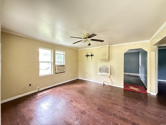 414 E 1st St, Rector, AR 72461 - unfurnished living room featuring heating unit, arched walkways, ceiling fan, ornamental molding, and baseboards