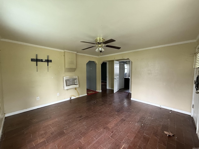 414 E 1st St, Rector, AR 72461 - unfurnished living room with heating unit, a ceiling fan, ornamental molding, wood finished floors, and baseboards