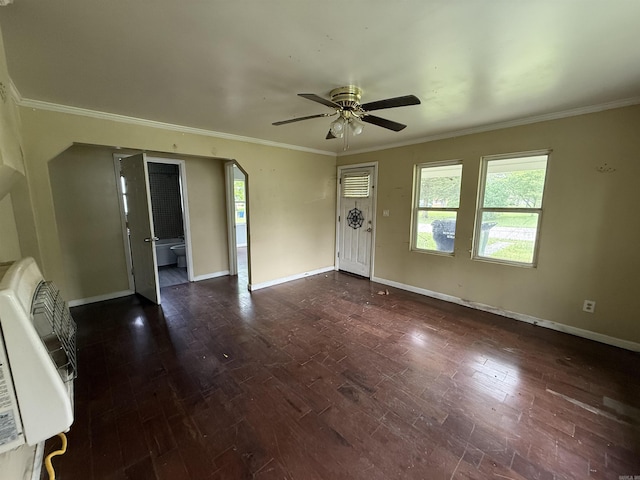 414 E 1st St, Rector, AR 72461 - unfurnished living room with heating unit, a ceiling fan, baseboards, ornamental molding, and dark wood-style flooring