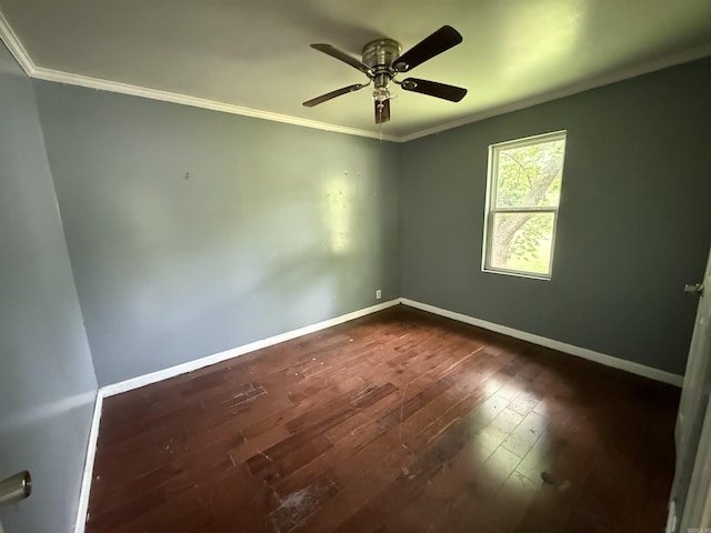 414 E 1st St, Rector, AR 72461 - empty room featuring crown molding, dark wood-style flooring, baseboards, and a ceiling fan