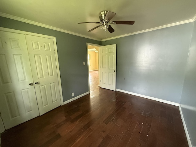 414 E 1st St, Rector, AR 72461 - unfurnished bedroom with dark wood-type flooring, baseboards, crown molding, a closet, and a ceiling fan