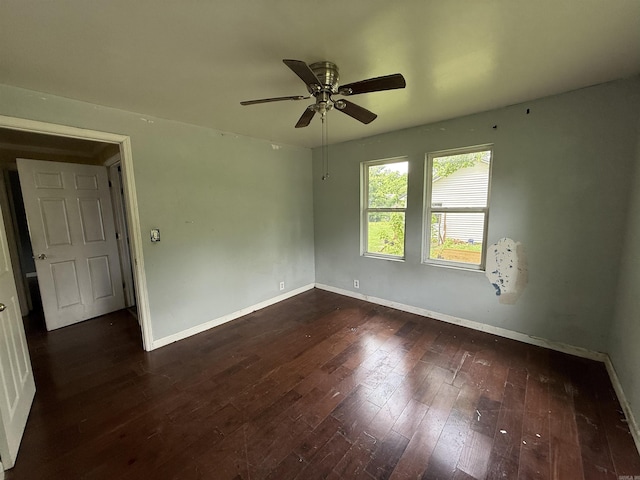 414 E 1st St, Rector, AR 72461 - spare room with baseboards, ceiling fan, and dark wood-style floors