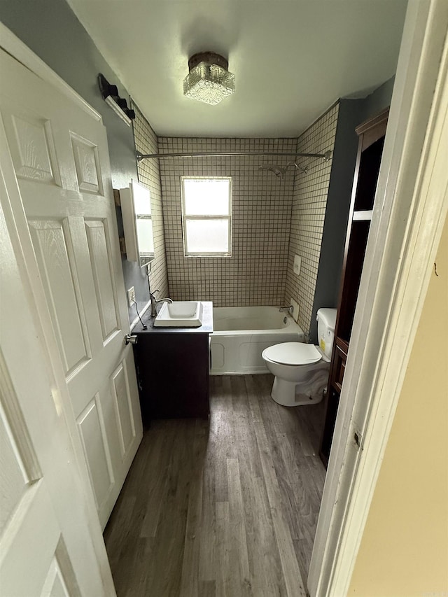 414 E 1st St, Rector, AR 72461 - bathroom with vanity, toilet, wood finished floors, and shower / bath combination