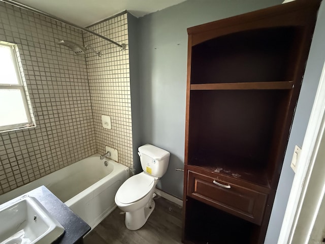 414 E 1st St, Rector, AR 72461 - full bath with toilet, tub / shower combination, and wood finished floors