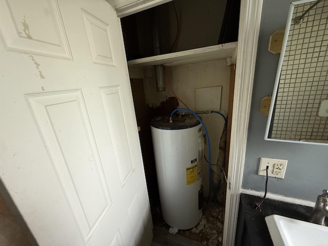 414 E 1st St, Rector, AR 72461 - utilities with water heater and a sink