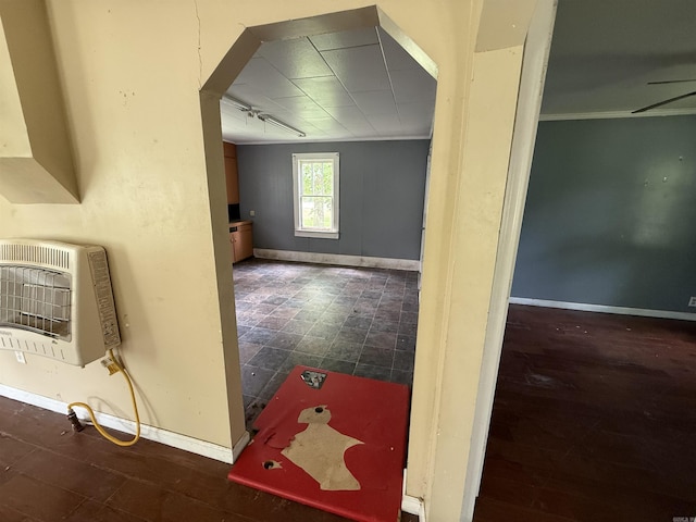 414 E 1st St, Rector, AR 72461 - hallway featuring heating unit, baseboards, and ornamental molding