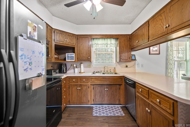6221 Bray Dr, Benton, AR 72019 - kitchen with freestanding refrigerator, a sink, black range with electric stovetop, stainless steel dishwasher, and brown cabinets