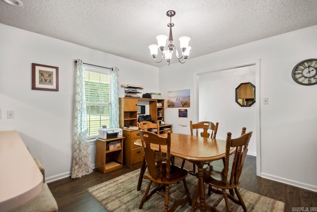6221 Bray Dr, Benton, AR 72019 - dining area featuring a chandelier, a textured ceiling, dark wood finished floors, and baseboards