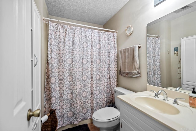 6221 Bray Dr, Benton, AR 72019 - bathroom with toilet, vanity, a textured ceiling, and a shower with shower curtain
