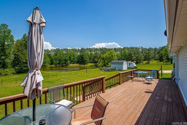 6221 Bray Dr, Benton, AR 72019 - wooden terrace with outdoor dining space, a water view, area for grilling, and view of wooded area