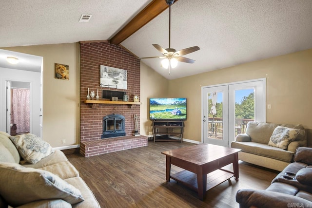 6221 Bray Dr, Benton, AR 72019 - living room with wood finished floors, a textured ceiling, baseboards, ceiling fan, and a brick fireplace