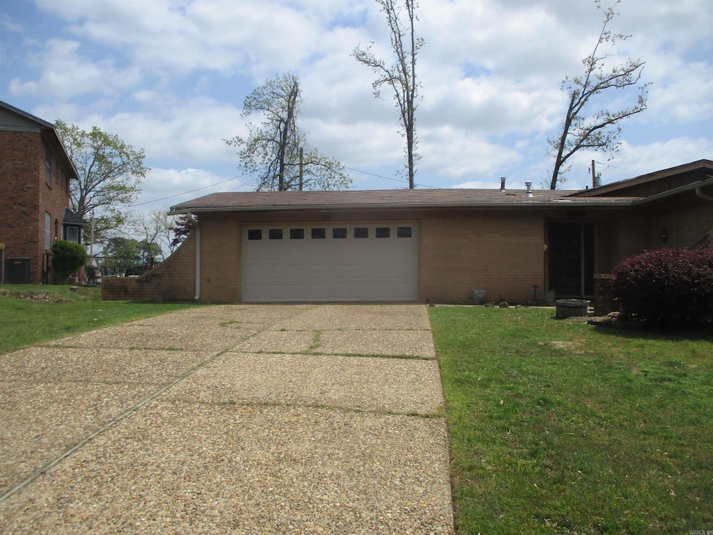 1521 Breckenridge Dr, Little Rock, AR 72227 - view of property exterior with driveway, brick siding, an attached garage, and a lawn