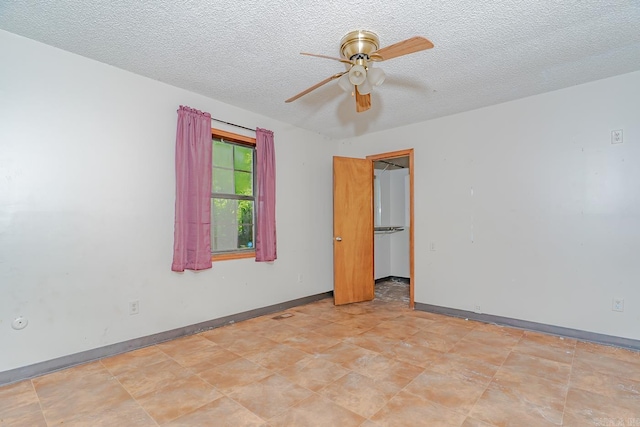 812 Glendale St, Jonesboro, AR 72401 - empty room featuring a ceiling fan, a textured ceiling, and baseboards